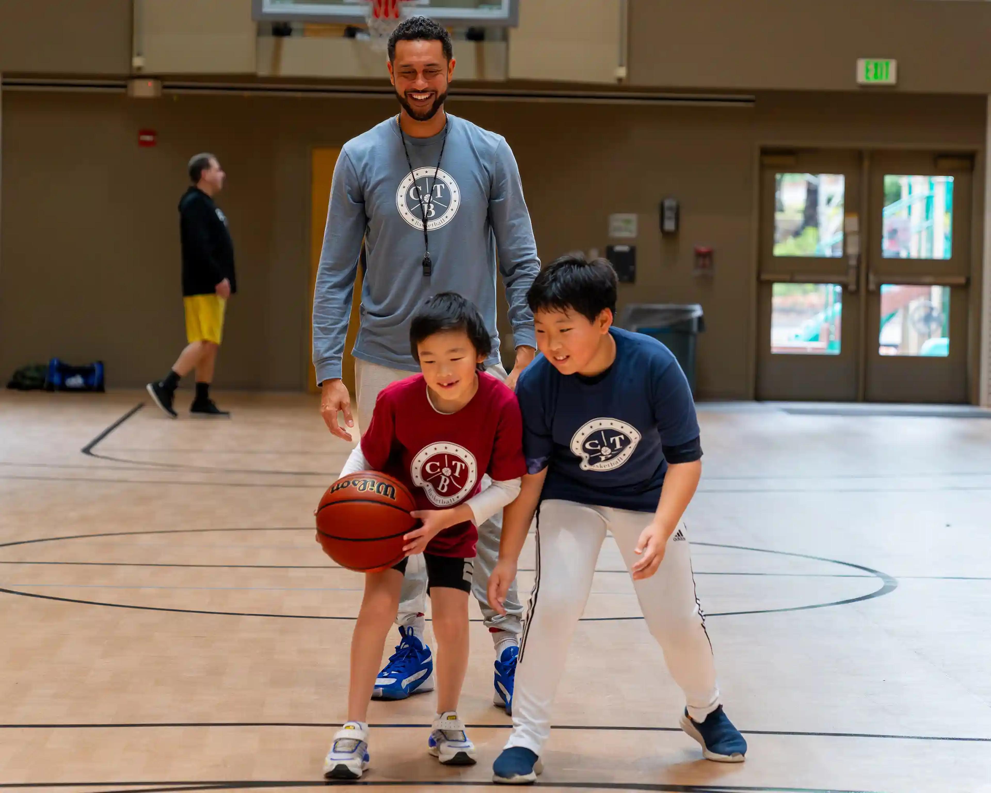 Two boys in a basketball drill