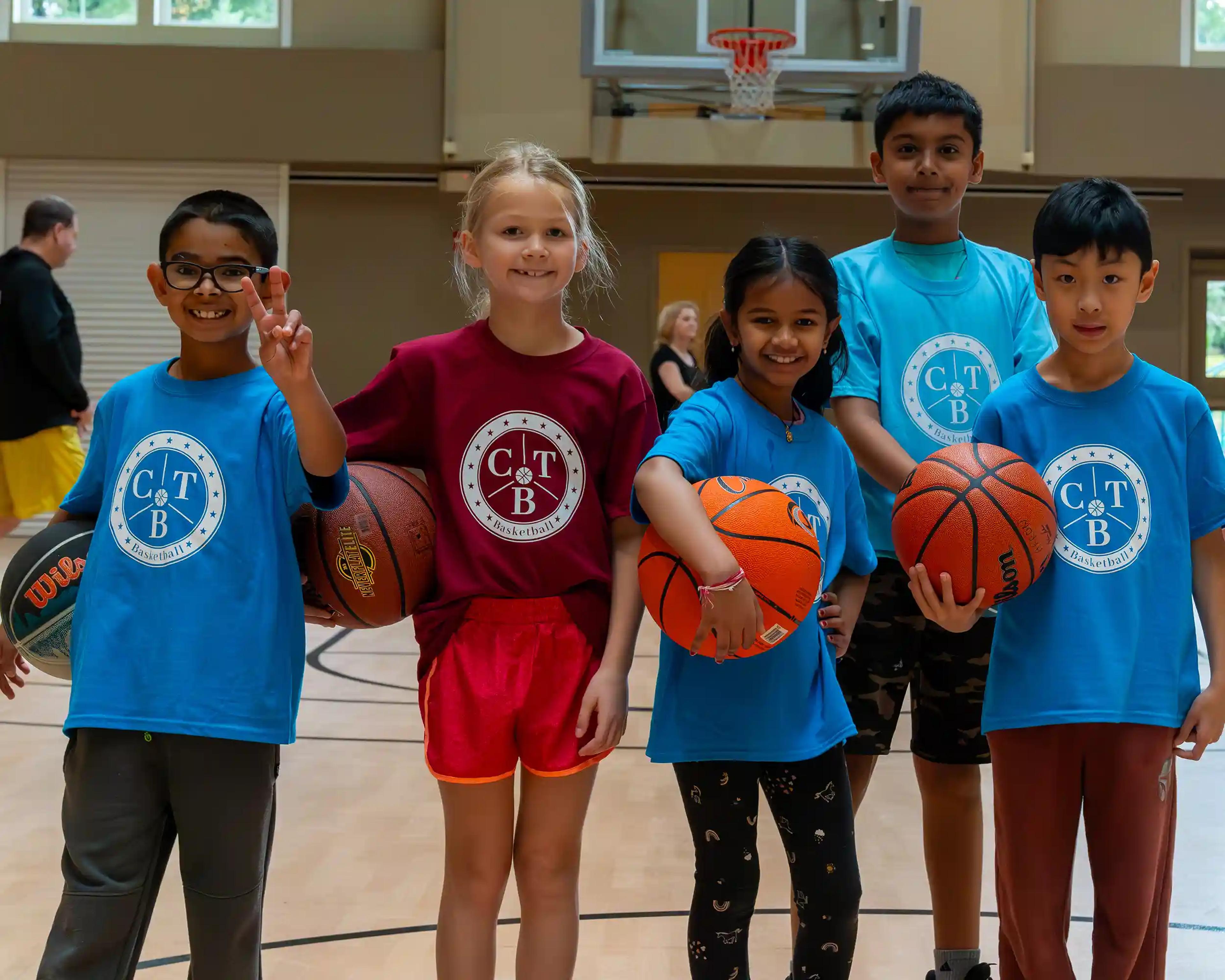 A group of young basketball players posing for the camera